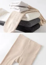 Display of custom ribbed baby tights in neutral colors, featuring high-stretch vertical knit and roomy diaper-friendly crotch. Premium soft cotton infant pantyhose collection from a professional OEM/ODM manufacturer.