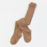 Custom caramel baby tights with delicate pointelle knit patterns, featuring breathable open-work stitching and high-stretch soft cotton blend. Premium infant pantyhose from a professional OEM/ODM manufacturer.