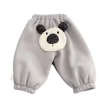 Custom grey baby joggers featuring a prominent 3D plush puppy appliqué with soft black ears, high-quality cotton fleece infant sweatpants, professional OEM/ODM kids clothing manufacturer.