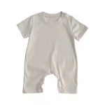 Custom pearl white baby romper, featuring short sleeves, classic crew neck, and snap-button closure for easy diaper access. Premium breathable soft cotton infant sunsuit from a professional OEM/ODM clothing manufacturer.