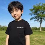 Reinforced shoulder-to-shoulder taping on custom womens T-shirt, premium neck tape for shape retention, durable garment construction from a professional OEM/ODM manufacturer.