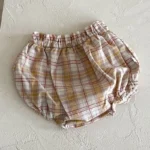 Custom yellow plaid baby bloomers, featuring breathable muslin cotton fabric, classic tartan print toddler diaper cover, premium ruffled elastic infant shorts from a professional OEM/ODM clothing manufacturer.