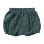 Custom dark green baby muslin bloomers, featuring breathable double gauze cotton, elegant ruffled elastic waistband and leg openings, high-quality toddler diaper cover from a professional OEM/ODM kids apparel manufacturer.