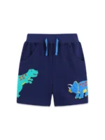 Custom navy blue baby shorts, featuring colorful dinosaur prints, an elastic waistband with contrast light blue drawstrings, and soft breathable cotton fabric. High-quality infant boy's summer bottoms from an expert OEM/ODM clothing manufacturer.