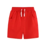 Custom bright red baby shorts, featuring a comfortable elastic waistband, white functional drawstring, and spacious side pockets. High-quality infant summer bottoms from a professional OEM/ODM clothing manufacturer.