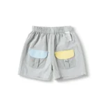 Custom light grey baby shorts, featuring contrast light blue and yellow flap back pockets, comfortable elastic waistband, and soft cotton-rich fabric. Premium infant utility summer bottoms from a professional OEM/ODM clothing manufacturer.