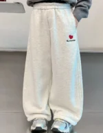 Custom off-white girls' wide leg sweatpants with heart embroidery, premium soft fleece kids' trousers, professional OEM/ODM children's clothing manufacturer.