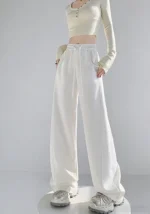 Custom high waisted white wide leg pants for women, stylish loose fit trousers for OEM and ODM clothing manufacturing.