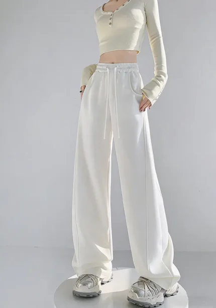 Custom high waisted white wide leg pants for women, stylish loose fit trousers for OEM and ODM clothing manufacturing.