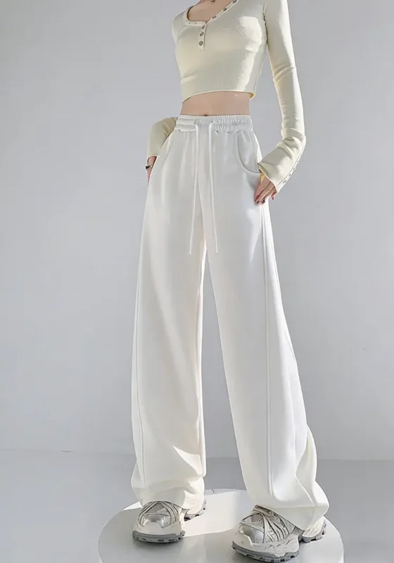 Custom high waisted white wide leg pants for women, stylish loose fit trousers for OEM and ODM clothing manufacturing.