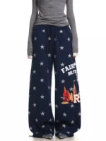 Custom navy blue wide leg pants with star pattern print and graphic lettering