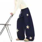 Custom navy blue wide leg pants with embroidered star pattern, premium loose fit trousers for women, professional OEM/ODM clothing factory services.