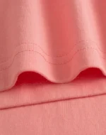 Natural hem detail on custom womens T-shirt, premium double-needle stitching, non-restrictive casual fit, high-quality combed cotton jersey from a professional OEM/ODM garment manufacturer.