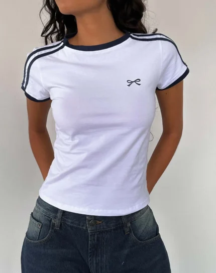 Custom white womens ringer T-shirt with navy blue contrast trim, stylish striped shoulder details and delicate chest embroidery, premium slim fit cropped tee from a professional OEM/ODM garment manufacturer.