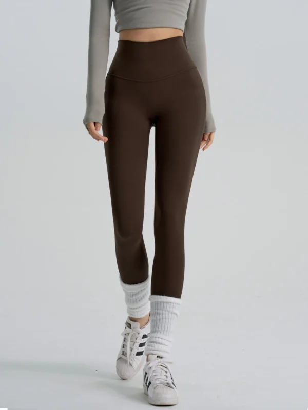 Deep brown high-waisted yoga leggings with a slimming fit, manufactured by a professional OEM/ODM activewear factory.
