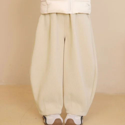 Custom cream white boys' corduroy pants, comfortable wide leg baggy trousers for kids, premium ribbed fabric children's wear from a professional OEM/ODM manufacturer in China.