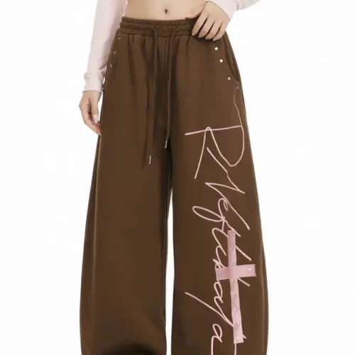 Custom brown wide leg sweatpants with pink graphic lettering print, oversized baggy joggers for women, professional OEM/ODM clothing manufacturer.