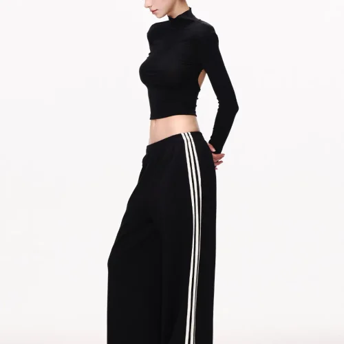Custom black wide leg pants with white side stripes, elegant athleisure trousers for women, high-quality apparel manufacturing and OEM services.