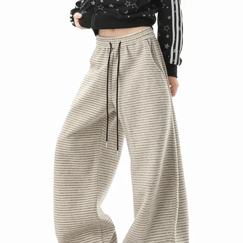 Custom grey wide leg sweatpants with drawstring, oversized baggy joggers for women, high-quality fleece trousers from an OEM/ODM garment manufacturer.
