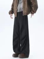 Black oversized wide-leg sweatpants with a relaxed straight fit, produced by an expert OEM/ODM streetwear manufacturer.