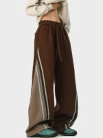 Brown wide-leg track pants with side stripe details and color-blocking, produced by an OEM/ODM streetwear manufacturer.