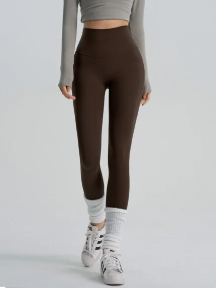 Deep brown high-waisted yoga leggings with a slimming fit, manufactured by a professional OEM/ODM activewear factory.