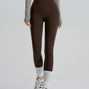 Deep brown high-waisted yoga leggings with a slimming fit, manufactured by a professional OEM/ODM activewear factory.